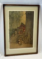 Frontal view of framed print against white background