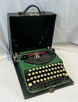 Open carrying case with typewriter inside, showing overall presentation
