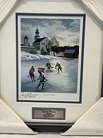 Front view of framed 1972 Hockey Hall of Fame print titled 'Saturday Morning' signed by Jean Beliveau, showing vintage outdoor ice hockey scene and signature.