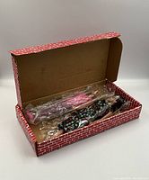 Both dolls and outfits in original box, wrapped in plastic