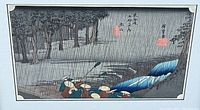 Full view of unframed print laid flat, showing travelers, bridge, forest and rain