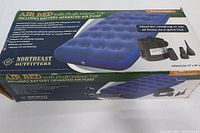 Box for Northeast Outfitters twin size air mattress with plush velour top, blue color shown, detailed box with mattress dimensions and features.