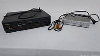 Overview of both Hitachi VHS player and Cyberhome DVD player with cables