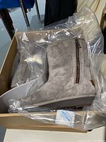 Gray UGG Mayfaire boot new and unopened in box, showing side zipper and suede material.