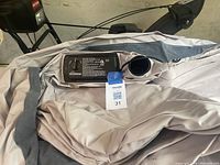 Photo of the inflatable double bed showing built-in electric pump and valve.