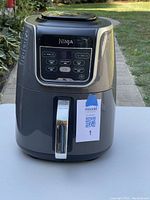 Front view of Ninja XL Air Fryer showing overall condition and design.