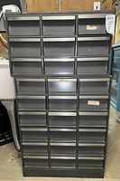Frontal view of entire cabinet showing arrangement of 35 drawers
