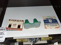 Top view of View-Master viewer and multiple View-Master reels including 'Hansel & Gretel' and instructional leaflets