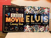 Front covers of both colouring books side by side, showing the titles and cover art.