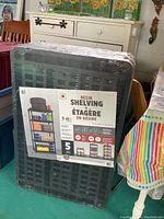 Photo of wrapped shelving showing front label with shelving unit image and details