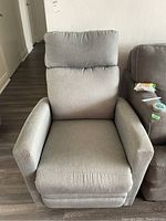 Top-down view of the gray upholstered reclining armchair showing the cushioned seat and armrests.