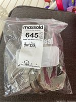 Image of a sealed plastic bag label indicating the lot number and Honda brand.