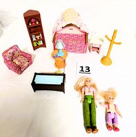 All 8 furniture pieces and 2 female dolls arranged on white surface.