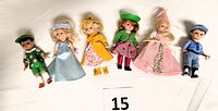Full set of six Madame Alexander 5-inch dolls arranged in a row, showing each character's outfit and accessories distinctly.