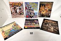 Front view of all 6 Pearls Before Swine paperback books arranged upright and flat on a white surface.