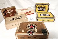 Photo of all six vintage cigar boxes showing variety in materials and graphic designs