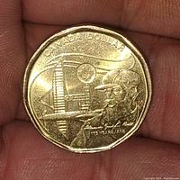 Obverse side of the coin showing the commemorative design of an oil worker with drill rig and maple leaf emblem, inscriptions included.