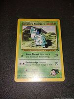 Front image of Giovanni's Nidoran Pokémon trading card showing card art, stats, attacks, and overall condition.