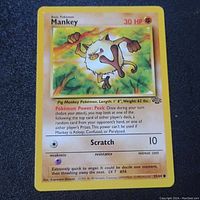 Close-up of a single Mankey Pokémon card from the Jungle set showing front face with attack description, HP, and illustration.