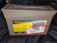 Top view of closed rectangular metal ammo can showing Magnum label and latch on lid.