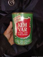 Front view of the green and red Kem Var varnish tin showing the product label and condition.