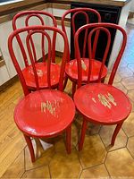 Front view of four red chairs grouped