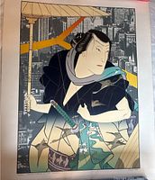 Full view of unframed art print laid on floor