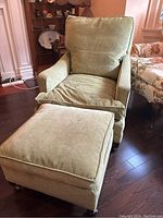 Armchair and ottoman together from front