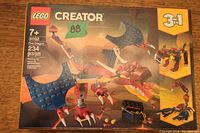Box front showing LEGO Creator 31102 Fire Dragon set, age 7+, 234 pieces, 3-in-1 build options.