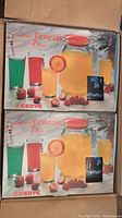 Photo of two unopened Cerve Venezia 7-piece glass pitcher and glass sets in original boxes.