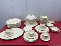 Full set of Wedgwood Edme off-white dishes including soup tureen, various plates, cups, and saucers