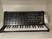Front view of Korg synthesizer showing keyboard and full patch panel