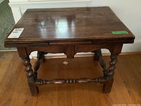 Front and side views of the oak side table showing barley twist legs and drop-leaf sides in closed position.
