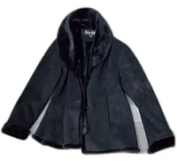 Front view of the black Marvin Richards jacket with faux fur collar and cuffs, button-up style, flared hem.