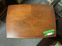 Top view displaying the wood grain pattern and rectangular shape of the table