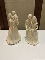 Front view of mother holding baby figurine and wedding couple figurine showing general appearance and details