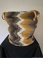 Full view of the large woven cotton basket showing the zigzag pattern and two handles