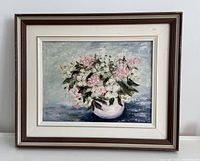 Framed oil painting of flowers in a vase, signed M. King.