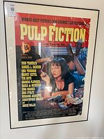 Framed Pulp Fiction movie poster featuring Uma Thurman with red background