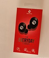 Front view of unopened red retail box showing Raycon branding and the earbuds image.