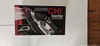 Box front of CHI SteamShot 2-in-1 Iron+Steamer depicting the iron and steam function details