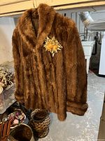 Front view of the brown vintage genuine fur jacket showing the plush fur and shawl collar
