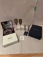 Overall display of glasses and wine accessories including boxed items from Mikasa and Seagull
