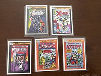 Five Marvel trading cards showcasing iconic characters with colorful comic book cover art: Wolverine, Avengers, X-Men, The Punisher, Journey Into Mystery.