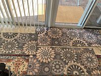 Three entrance carpets arranged on floor by sliding door, showing full pattern and size relation