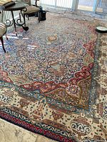 Full view of rug on tiled floor showing overall pattern and scale