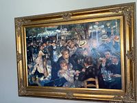 Full view of the large framed canvas wall art showing a crowded social dance or party scene with people seated and standing under hanging lights.
