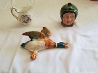 Full view of mallard figurine, Royal Crown Derby creamer, and Beswick jam pot