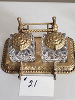 Front perspective showing base, glass bottles, and lids