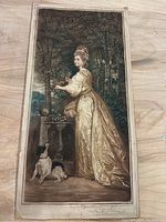 Full view of antique art print featuring a lady in golden dress with dog, the background is trees and stone pedestal.